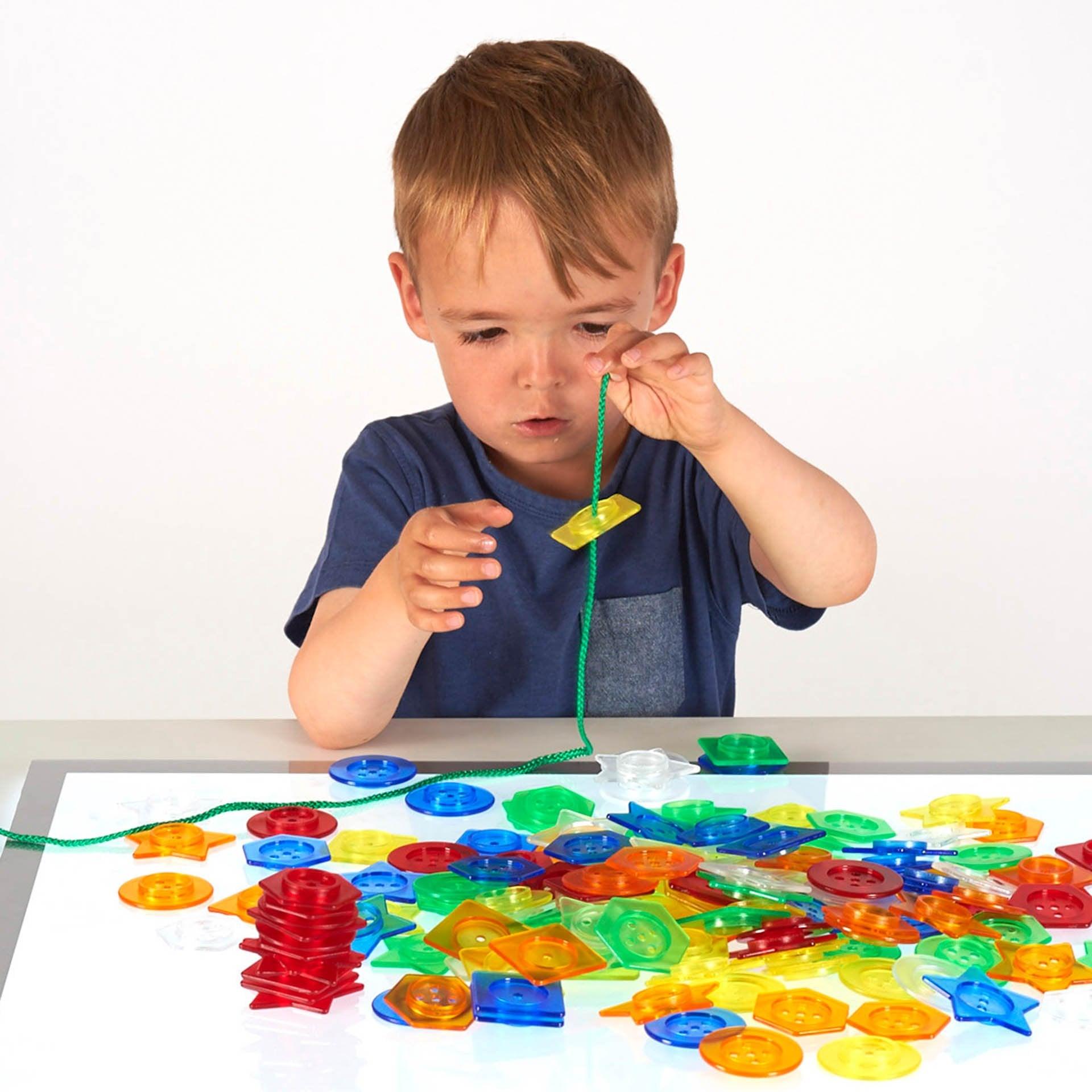 Tickit Stackable Translucent bottoni traslucidi 144 pezzi con lacci